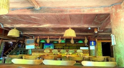 a room with a bunch of chairs and lights at Pu Luong Hostel in Ải Hạ