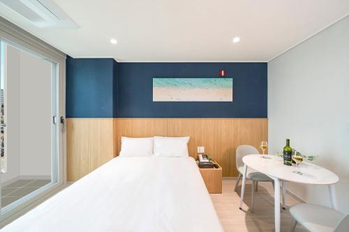 Ένα ή περισσότερα κρεβάτια σε δωμάτιο στο Stay More Residence Dongtan