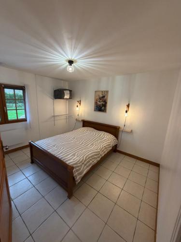 En eller flere senge i et værelse på Le Hiboux