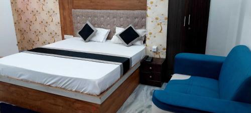 Voodi või voodid majutusasutuse Collection O Digha Ghat Formerly Hotel Shahnai toas