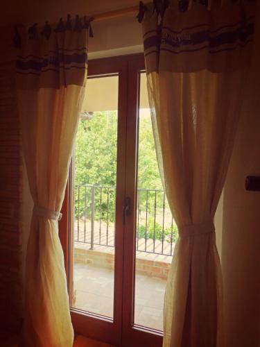 a pair of curtains in front of a window at Casale del Sole in Cepagatti