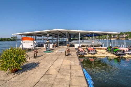 a dock with boats parked on the water at Lodge of Four Seasons Golf Resort, Marina & Spa in Lake Ozark