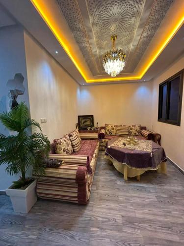a living room with a couch and a table at Sidi ifni hébergement in Sidi Ifni
