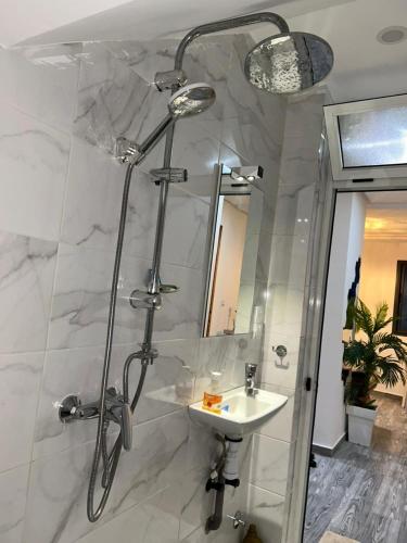 a bathroom with a shower and a sink at Sidi ifni hébergement in Sidi Ifni