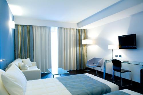 Tempat tidur dalam kamar di Hotel Napoleon