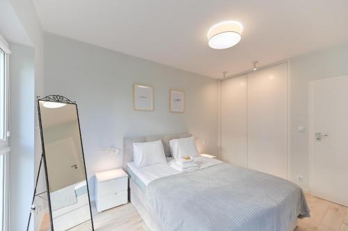 Postel nebo postele na pokoji v ubytování Apartament pistacjowy z parkingiem