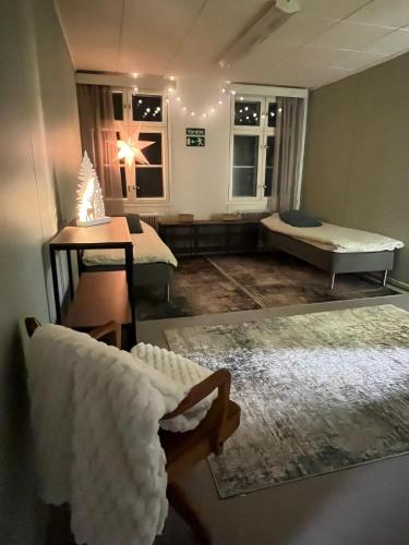a living room with a couch and a bed at Raanu Apartment 45 minutes from Rovaniemi center in Raanujärvi