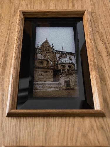 a picture of a building in a wooden frame at Leonardo 2 in Kraków