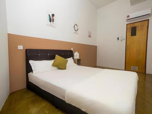 Postel nebo postele na pokoji v ubytování OYO Home 90554 Norfa Camp House