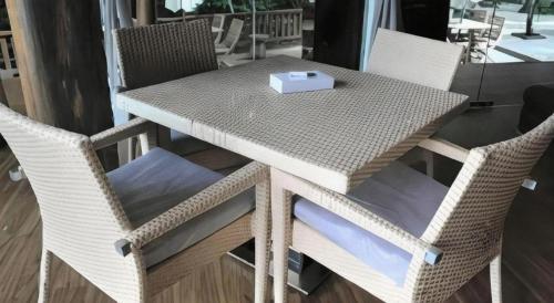 a table and chairs with a box on top of it at Bidaisari Resort in Kampong Sum Sum