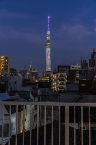 a view of the eiffel tower lit up at night at moire Edo Hotel Asakusa in Tokyo