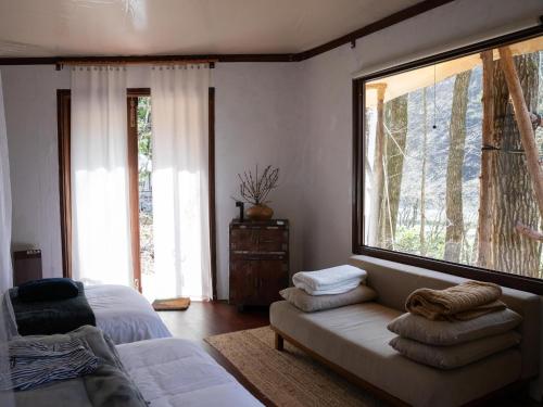 a living room with a couch and a large window at LATERAL - Vacation STAY 36610v in Shiojiri