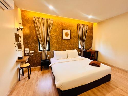 Postel nebo postele na pokoji v ubytování Sim Vintage Villa Langkawi