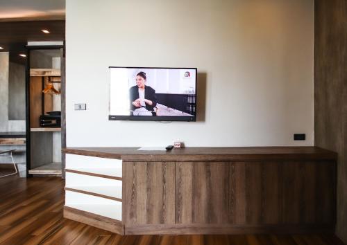 TV a/nebo společenská místnost v ubytování Acqua Hotel