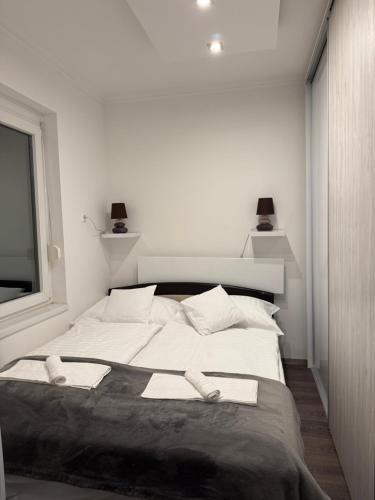 Ένα ή περισσότερα κρεβάτια σε δωμάτιο στο Jégmadár Apartman