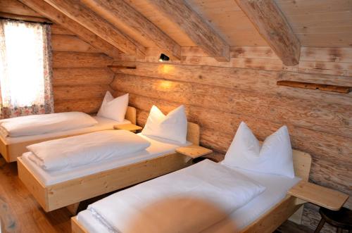 Ένα ή περισσότερα κρεβάτια σε δωμάτιο στο Ferner Alm