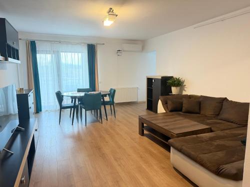 a living room with a couch and a table at Dante Residence in Alba Iulia