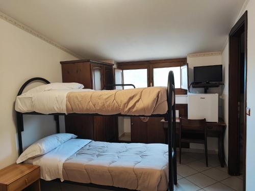 Ένα ή περισσότερα κρεβάτια σε δωμάτιο στο Il Rifugio