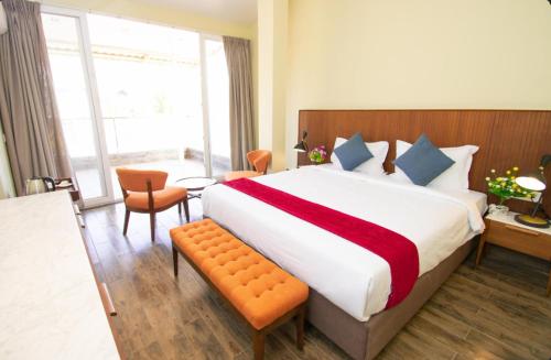 Ένα ή περισσότερα κρεβάτια σε δωμάτιο στο Estherea Elite Morjim