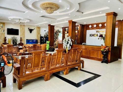 a restaurant with a table and chairs in a room at Khoa Thanh Hotel in Mai Chau