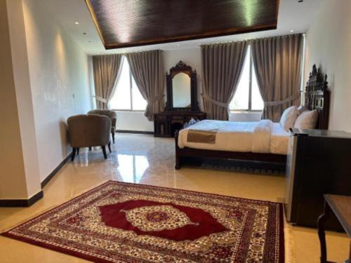 Giường trong phòng chung tại Miramonte Lodges