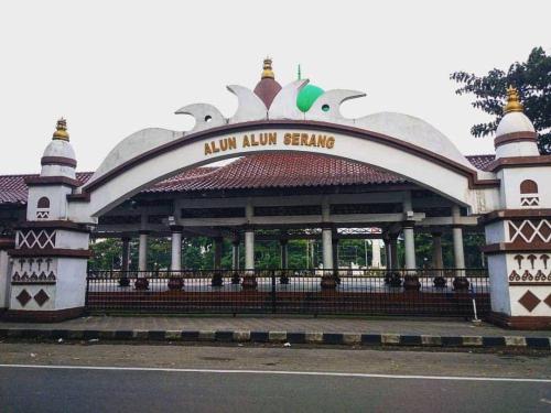 a building with a sign on the side of a street at GreenLeaf Serenity Hotel in Kalodran