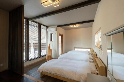 Ένα ή περισσότερα κρεβάτια σε δωμάτιο στο Dannoura Resort Villa