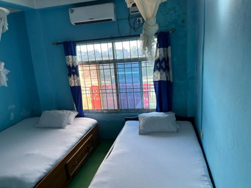 Postel nebo postele na pokoji v ubytování Shubh laxmi hotel Itahari