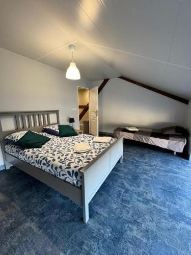 a bedroom with two beds in a room at Coeur d'Argonne in Dombasle-en-Argonne