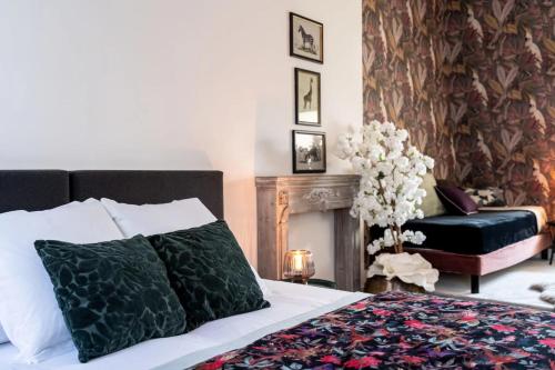 Cama o camas de una habitación en Le Henri II - logements d'exceptions entièrement autonomes