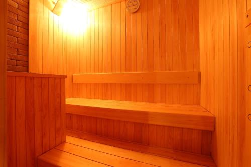 a sauna with a light on the inside of it at Kawaguchiya Kinosaki Riverside Hotel in Toyooka