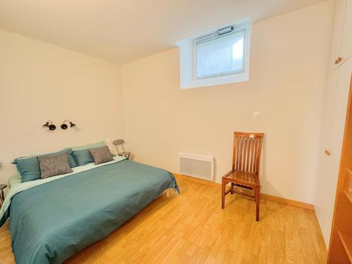 Voodi või voodid majutusasutuse Au bord de la rivière à Pont-Labbé toas