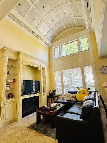 a living room with a couch and a table at Grace Sweet Homes Kingsize Bedroom NOT A PRIVATE HOUSE - SHARED AMENITIES in Richmond