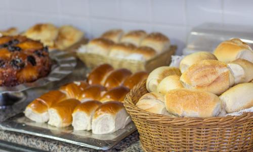 a bunch of buns in baskets on a table at Hotel Pousada Atlântica in João Pessoa