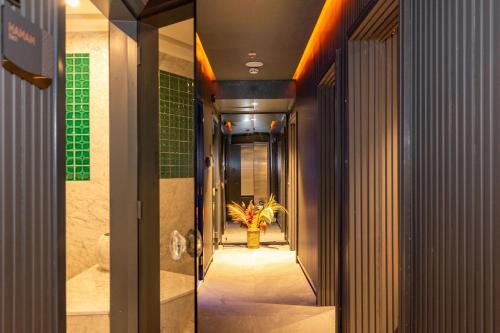 a hallway with a yellow fire hydrant in a building at QUİ Hotel&SPA in Istanbul