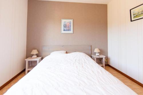 En eller flere senge i et værelse på Maison Cri-Cri à Arès