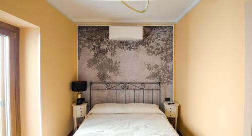 Una cama o camas en una habitación de Orizzonte Infinito b&b