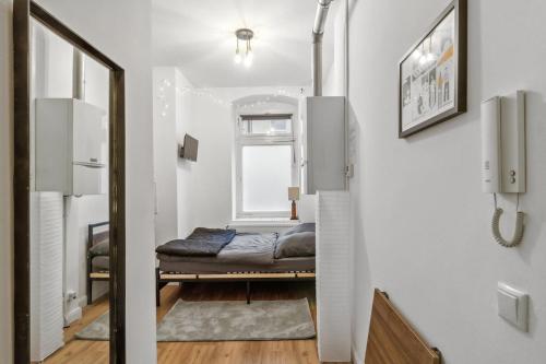 Ένα ή περισσότερα κρεβάτια σε δωμάτιο στο Cosy mini-appartment in Prenzlauer Berg