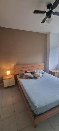 Ένα ή περισσότερα κρεβάτια σε δωμάτιο στο Appartamento Santa Barbara