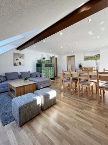 a living room with a couch and a table at Bergnescht - Dein Wohnfühlort im Schwarzwald in Todtnauberg