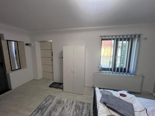 En eller flere senge i et værelse på Rinn Residence