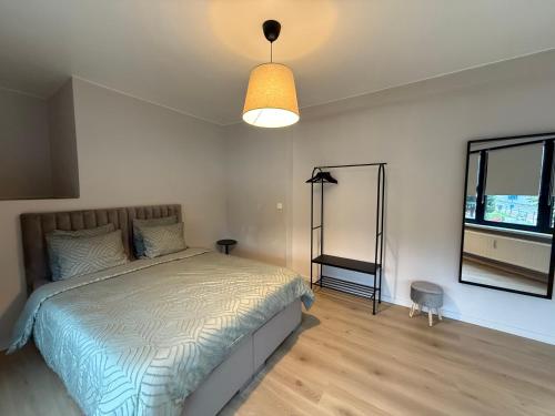 Ένα ή περισσότερα κρεβάτια σε δωμάτιο στο Appartement Brussels Expo II