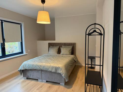 Ένα ή περισσότερα κρεβάτια σε δωμάτιο στο Appartement Brussels Expo II