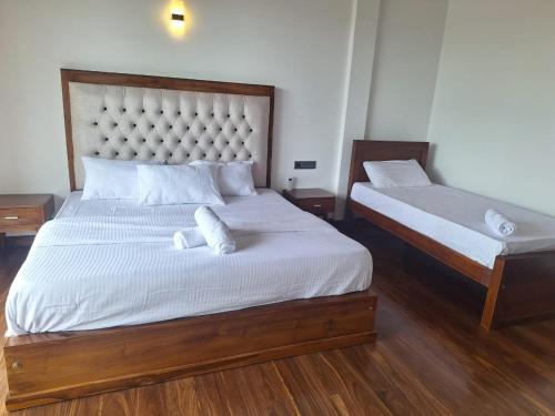 Кровать или кровати в номере Galle Bloom Luxury Apartments