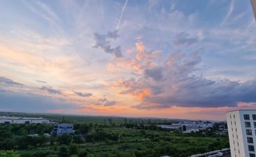 a view of a cloudy sky over a city at AV Urban Retreat in Ploieşti