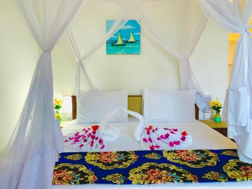 Ένα ή περισσότερα κρεβάτια σε δωμάτιο στο Protels La Plage