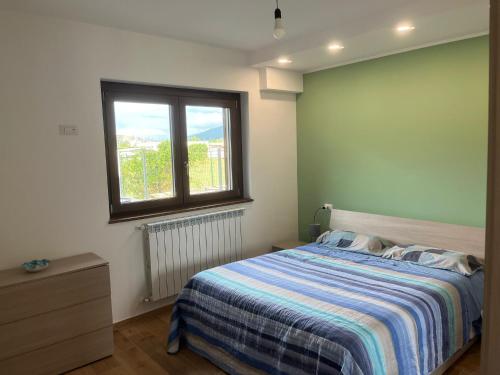 Postel nebo postele na pokoji v ubytování Jamari Sangro House