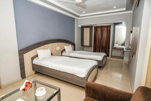 Ένα ή περισσότερα κρεβάτια σε δωμάτιο στο Hotel Sun-Om