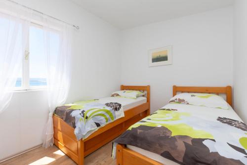 Postel nebo postele na pokoji v ubytování House Damir