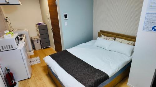 En eller flere senge i et værelse på Tateishi House101